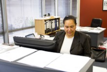 Akanesi Havea working at her desk