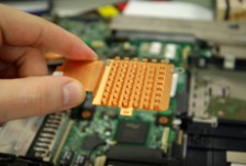 A hand holding part of a circuitboard