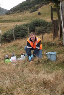 An environmental engineer in farmland collecting samples