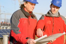 Two environmental engineers looking at a document
