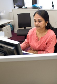 Lakshmi Murali working at a computer