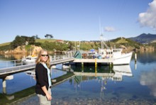 Candida Savage standing near a boat