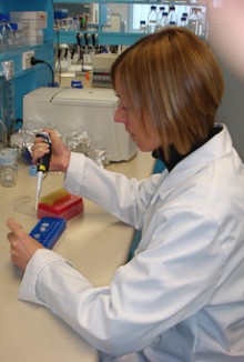 Tina Summerfield holding a chemical dropper