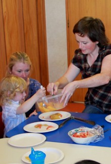 Vicky Sweeney passing food to a child who suffers from eating difficulties