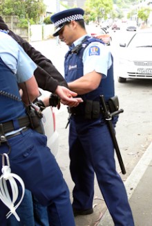 Jana and a colleague arresting a man