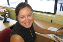 Rawinia Lewis working at her desk