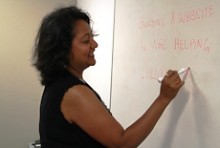 Kaushiki Roy writing on a whiteboard