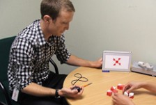 Psychologist doing an assessment at a table