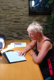 Valerie Couper working on her laptop