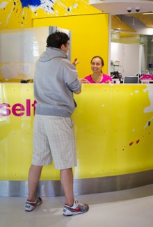 Tepora Stowers talking to a customer at reception