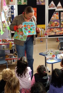 Anne Sisam standing in front of a group of school children