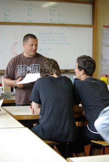 Craig Rofe standing at the front of the classroom