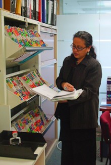 Janine Olasa looking through case notes