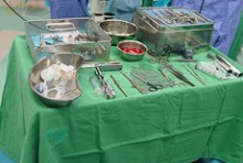 A table with surgical equipment laid out on it