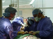 Surgeons operating on a patient