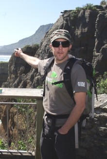 Zane Smith pointing to the Punakaiki rocks