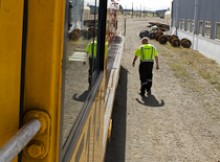 Jim Featherstone walking along a track beside a locomotive