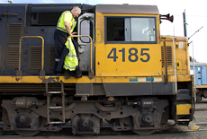 Jim Featherstone climbing down from a locomotive