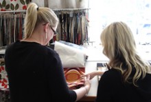 Nikki Burnet talking to a customer in a sample room