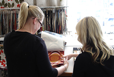 Nikki Burnet talking to a customer in a sample room