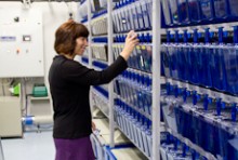 Julia Horsfeld touching a container in a lab