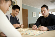 A family group playing scrabble.