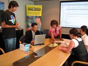 Staff in the retail industry discuss a presentation.