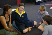 Te reo Māori teacher working with a group of students.