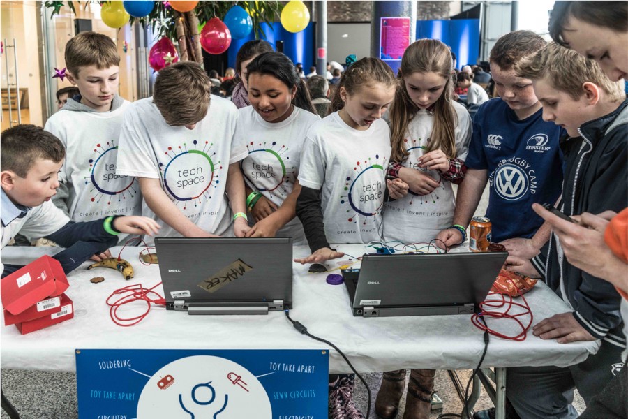 Kids looking at laptops