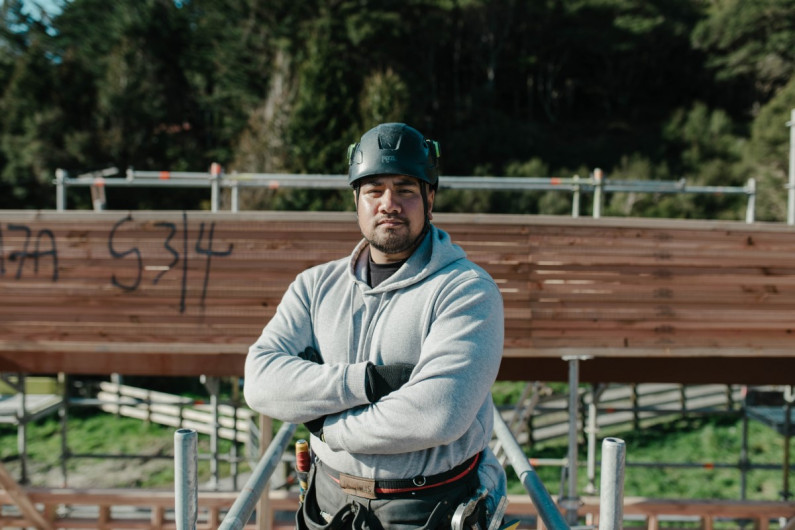 Building apprentice AJ at a construction site