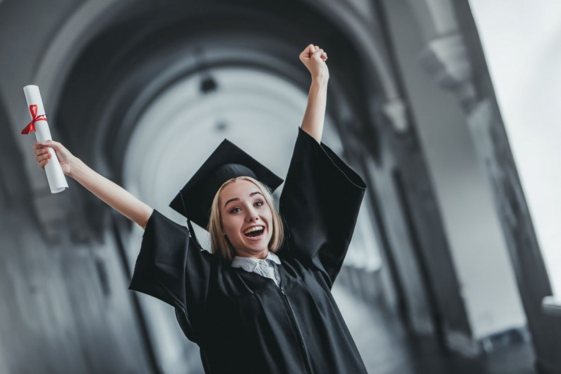 A new graduate celebrates her achievement
