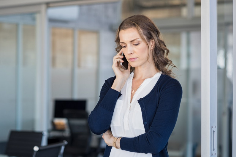 Woman receives bad news over the phone