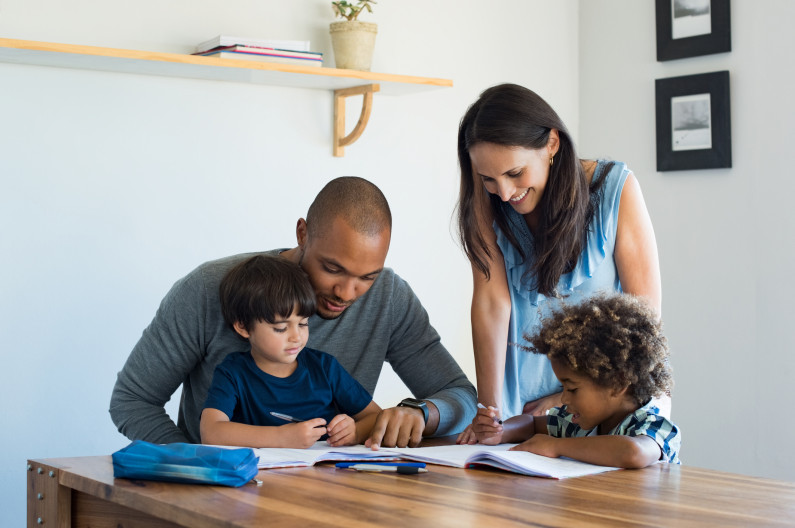 Parents helping children with homework