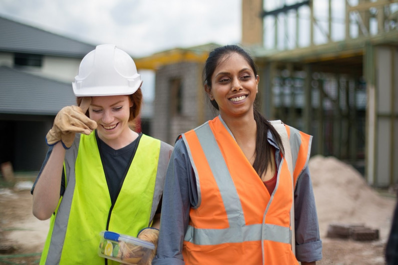 Two smiling construction workers 