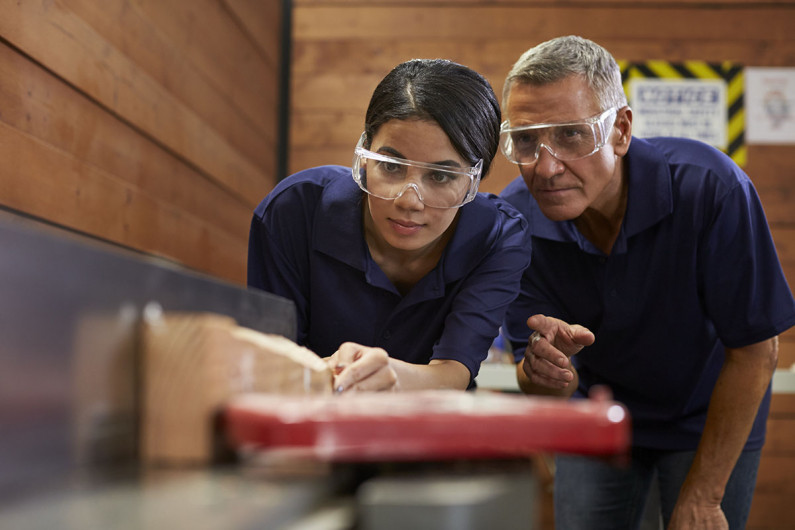 first week at work article woman operating saw iStock