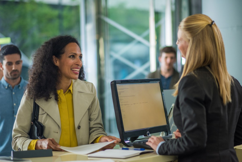 Bank teller talking to a customer