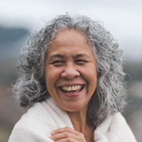 Middle-aged woman smiles at camera