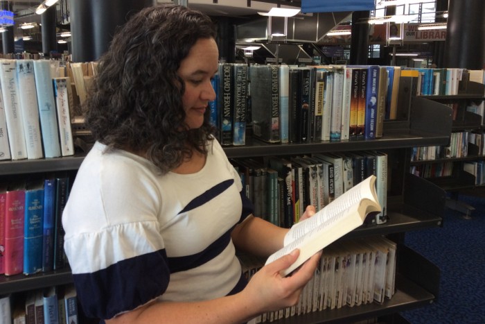 Whiti Hereaka reads her book in the library