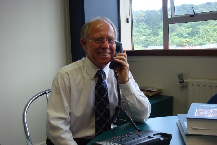 Brian Klee talks to a client on the phone