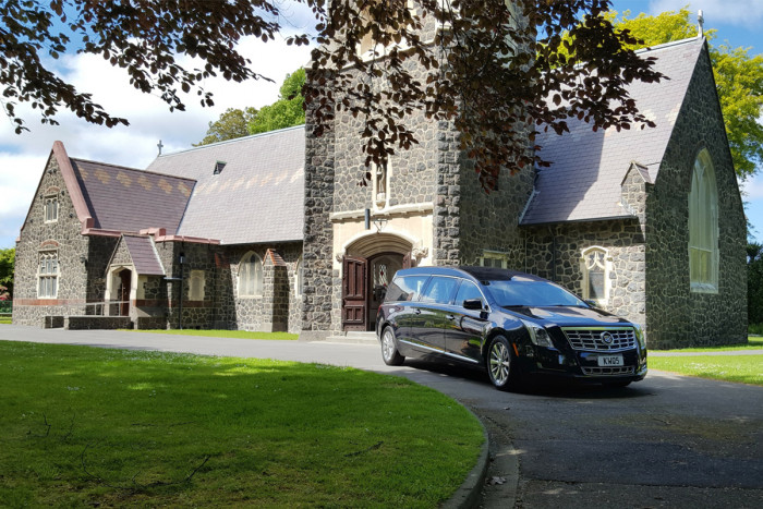 A hearse outside a church