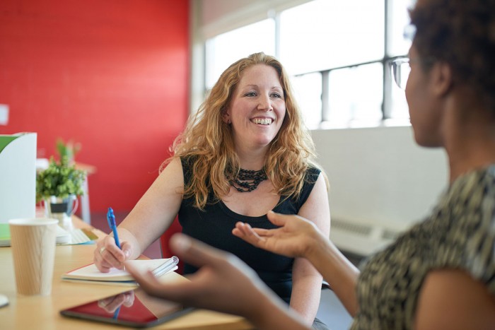 A woman interviews another woman