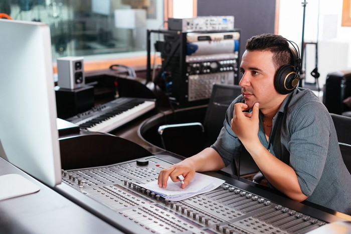 Sound technician working at a mixing desk