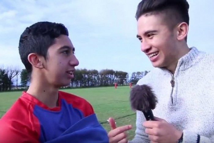 Sonny Ngatai interviewing a young boy about rugby
