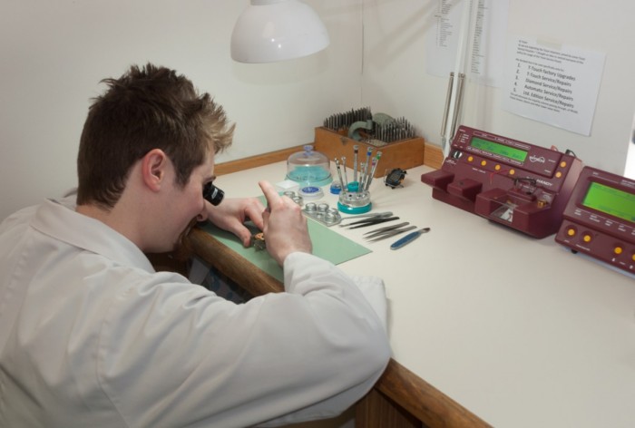 Andrew Clark working on a watch at a workbench