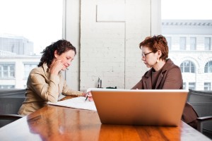 Two people meet and discuss a contract