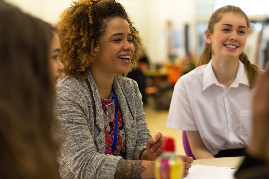 A teacher helps students during class